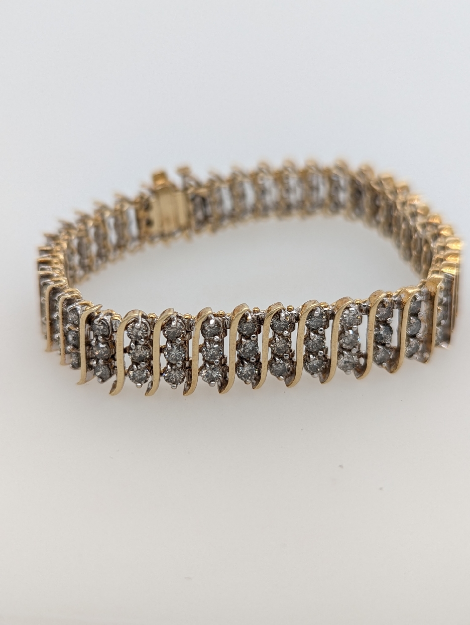 10K Yellow Gold Triple Diamond S Link Tennis Bracelet; 11 CTTW; L-N Color; I1-2 Clarity 7 inch
