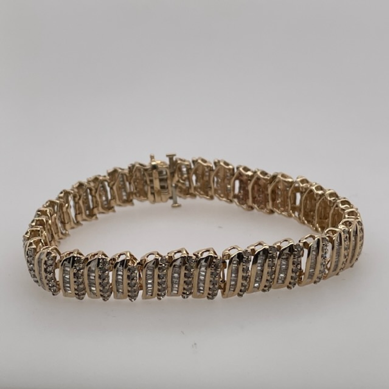 10k Yellow Gold Diamond Tennis Bracelet with Round and Baguette Diamonds 7 inches

2.55 CTTW