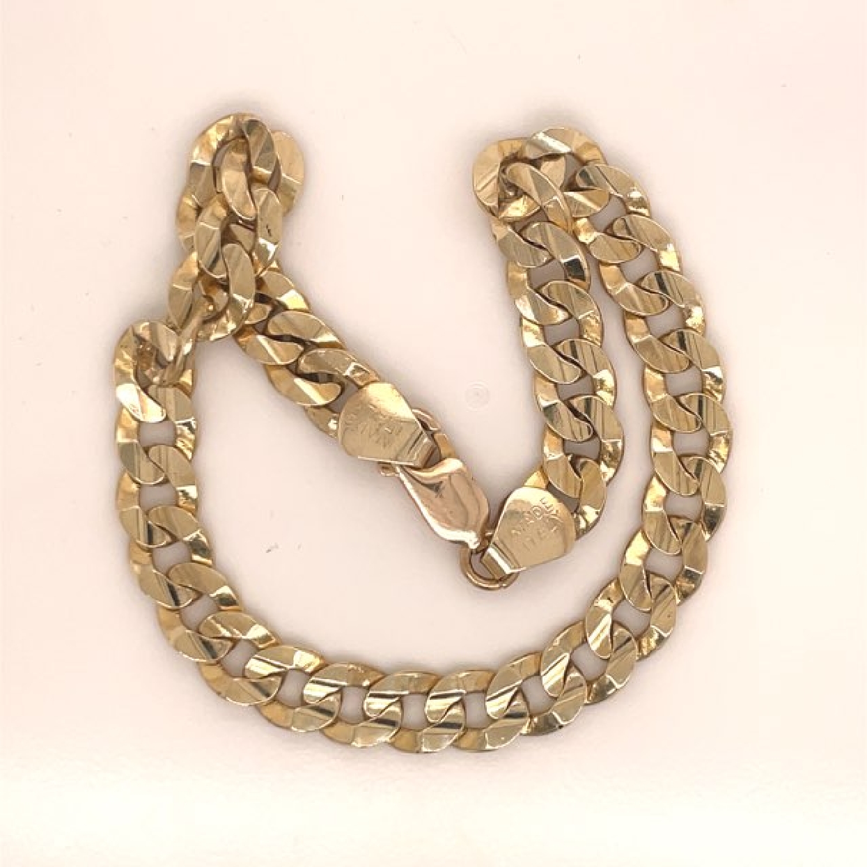 10K Yellow Gold Curb Chain Bracelet

Length: 9 Inches