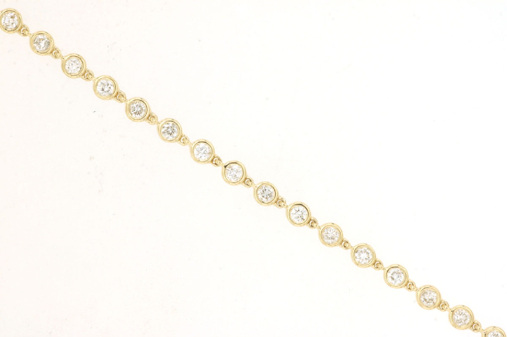 14K Yellow Gold Bezel Set Diamond Link Bracelet with Lobster Clasp 

7 Inches
1cttw Diamonds