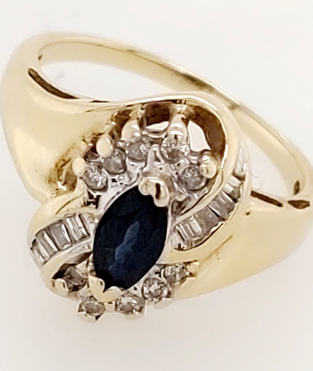 10K Yellow Gold Cluster Ring with Marquise Sapphire and Round and Baguette Diamonds. Size 7
