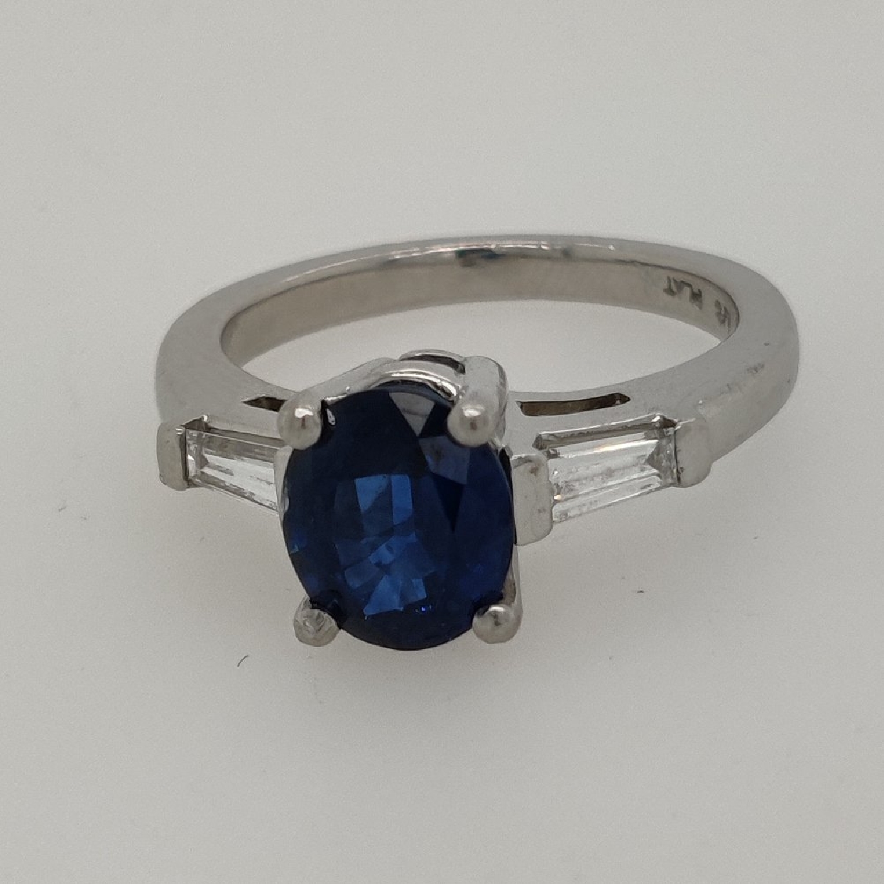 Platinum and Sapphire Ring with 2 Diamond Baguettes; Size 4.5
1.71CT Sapphire