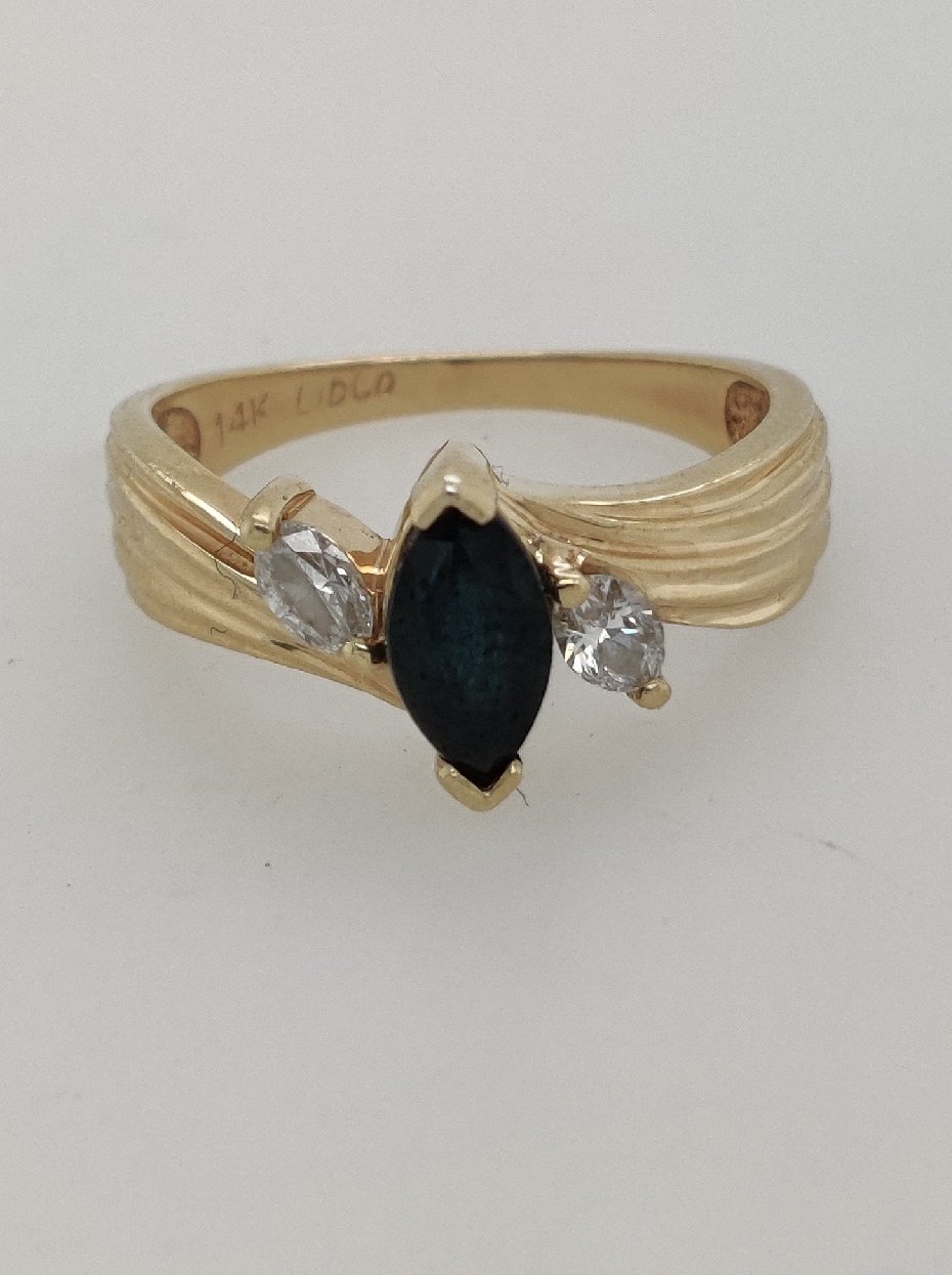 14K Yellow Gold Ring with Marquise Cut Sapphire and 2 Marquise Cut Diamond Accents; Size 6

Independent Appraisal on File