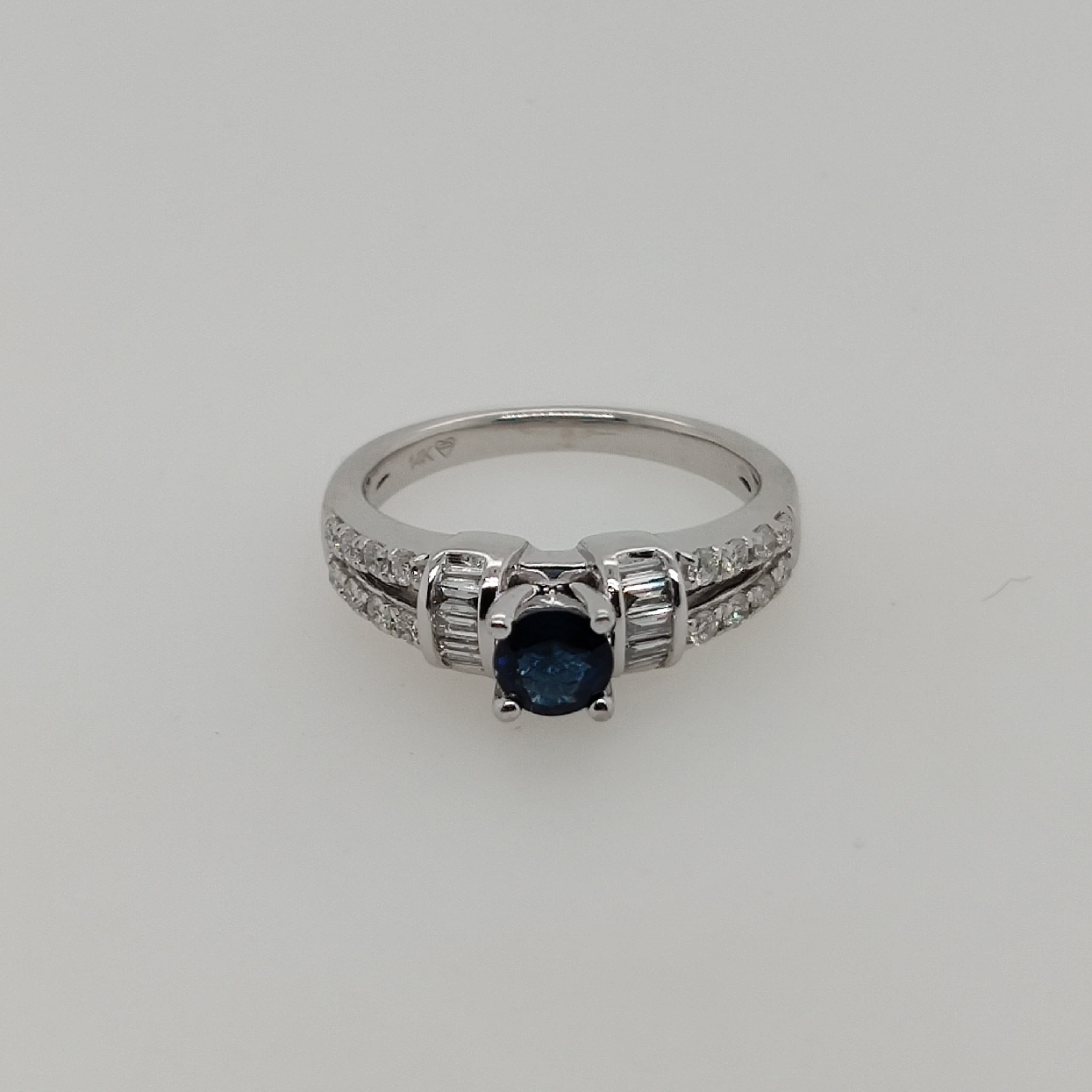 14K White Gold Sapphire and Diamond Ring; Size 7
Sapphire weighs 0.60CT; and Diamonds weigh Approximately 0.32CTTW; H-I/I1

Appraisal on File