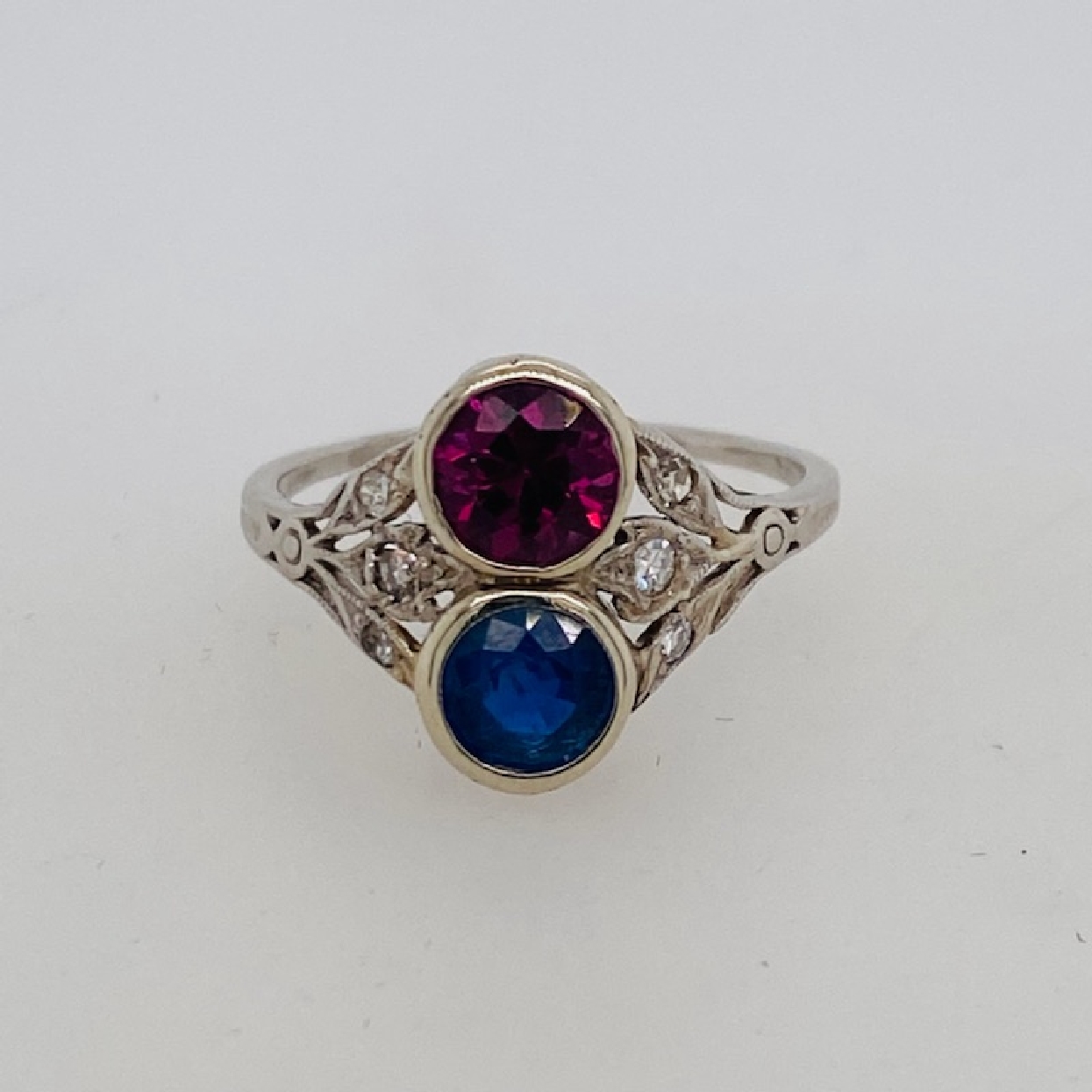 Edwardian Platinum Sapphire and Rubellite Ring with Diamond Accents; Size 6.75

Circa 1900