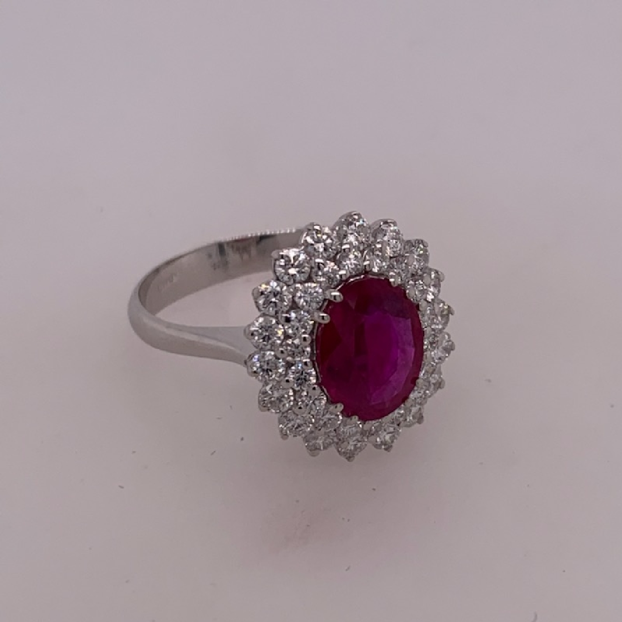 18k White Gold Oval Natural Step Cut Burma Ruby with Double Diamond Halo Size 7

Ruby: 1.63ct

Comes with Copy of GIA Cert