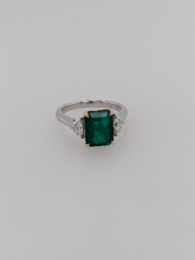 Platinum and 18K Yellow Gold Emerald Cut Emerald Ring with Two Half Moon Diamond Accents; Size 7
Emerald weighs Approximately 3.06CT
Diamonds weigh Approximately 0.47CTTW