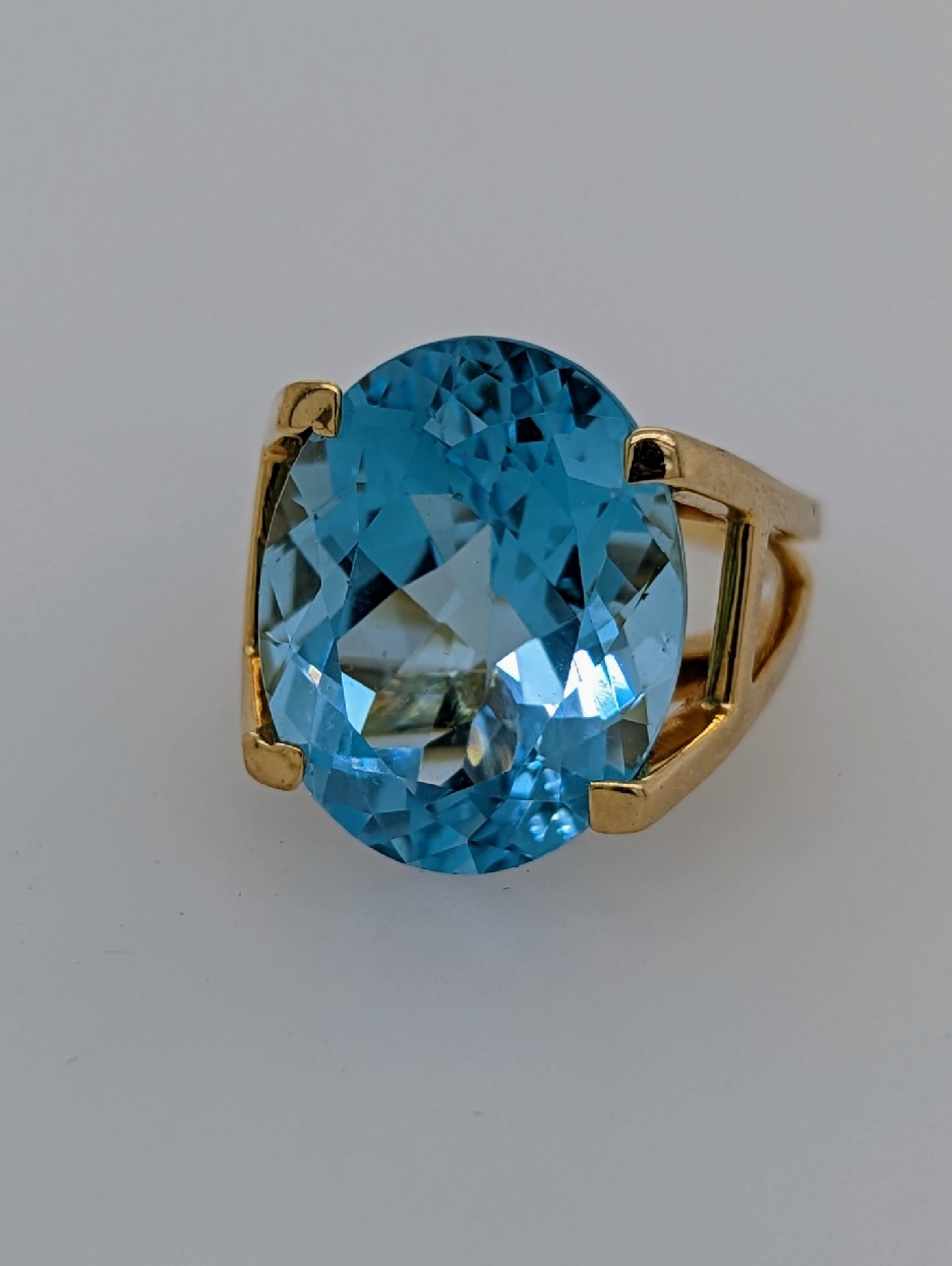 14K Yellow Gold Large Oval Blue Topaz Ring in a Cathedral Setting; Size 7.75