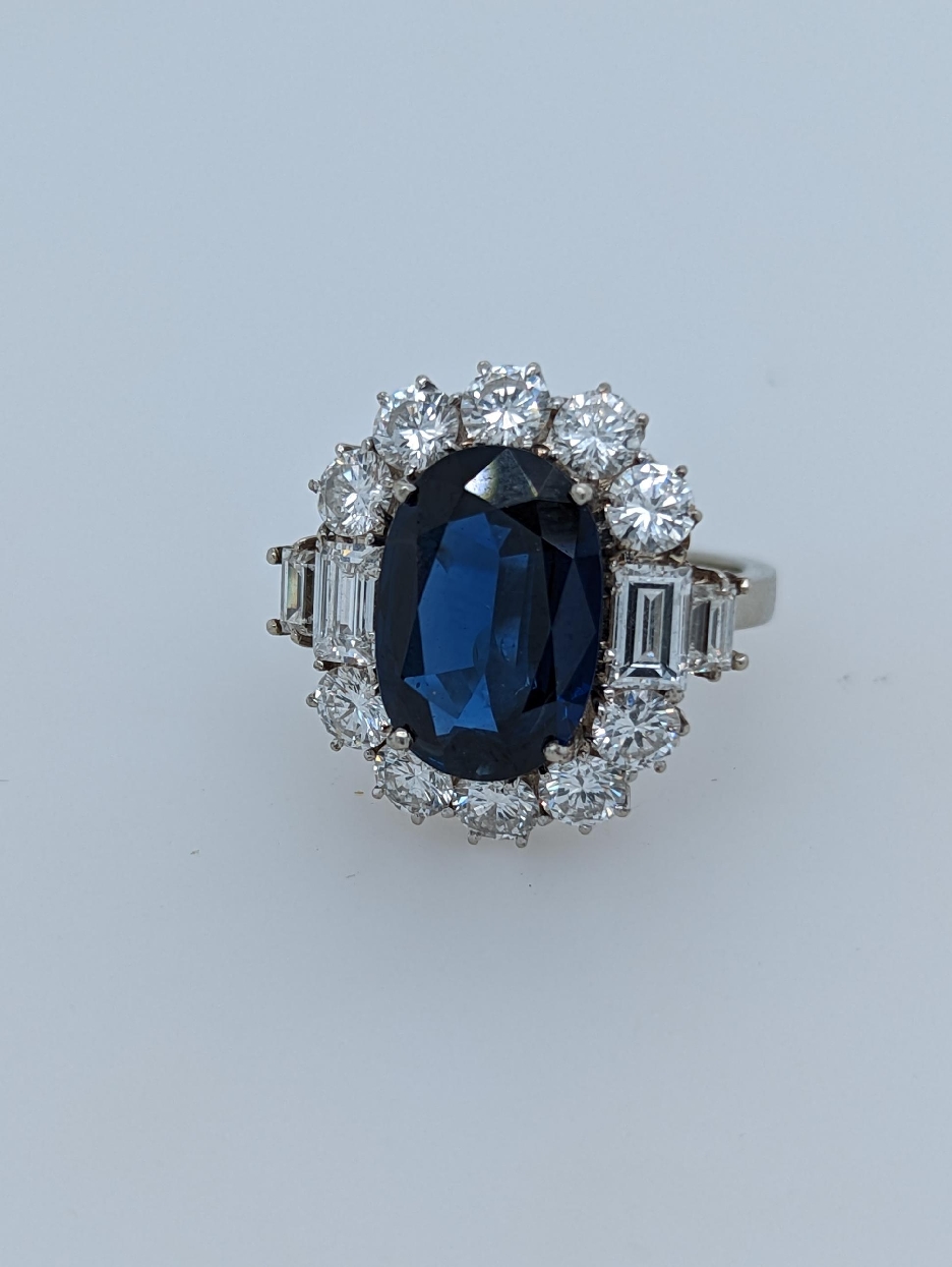 14K White Gold 5CT Sapphire Ring with Round and Baguette Diamond Accents; Size 5.75

Comes with Copy of AGL Gem Report