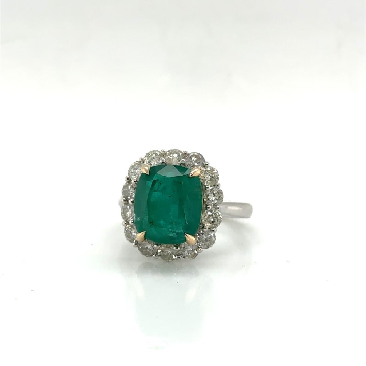 14K White and Yellow Gold with a Cushion Cut Emerald 5.99 ct and Diamond Halo 1.5 ct 
Size 7