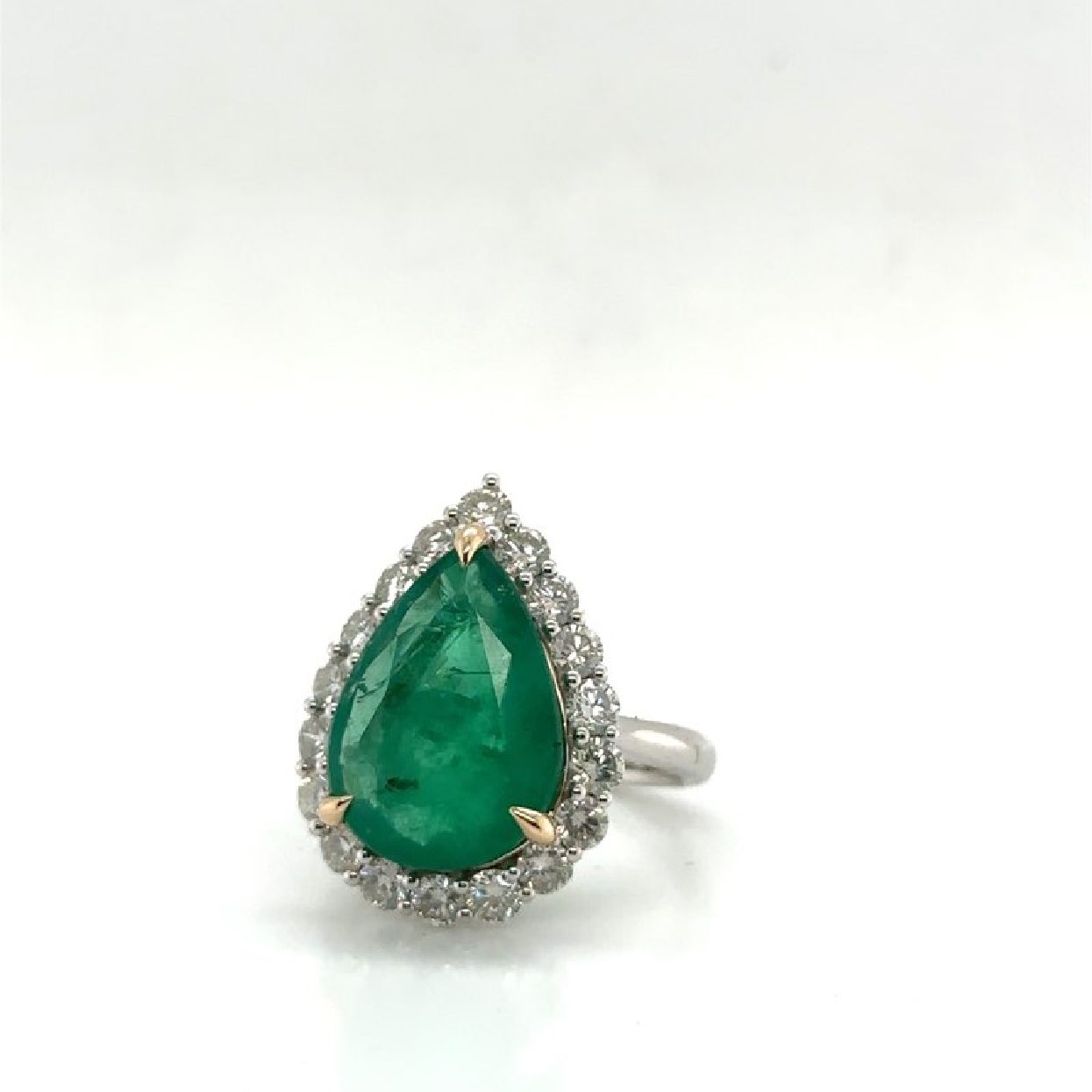 14K White and Yellow Gold Ring with a 6.49 ct Pear Cut Emerald and 1.42 ct Diamond Halo 
Size 7