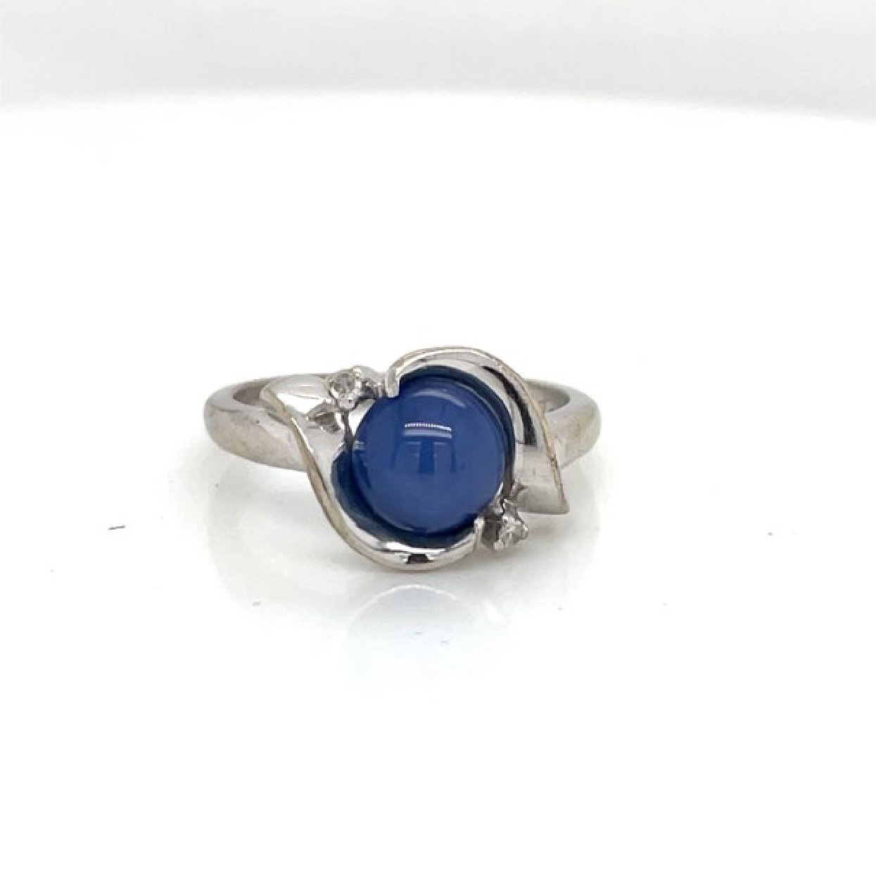 14K White Gold Star Sapphire Ring with Diamond Accents

Size 5.75