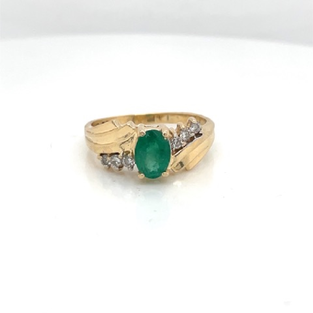 14K Yellow Gold Emerald Ring with Diamond Accents

Size 7.5