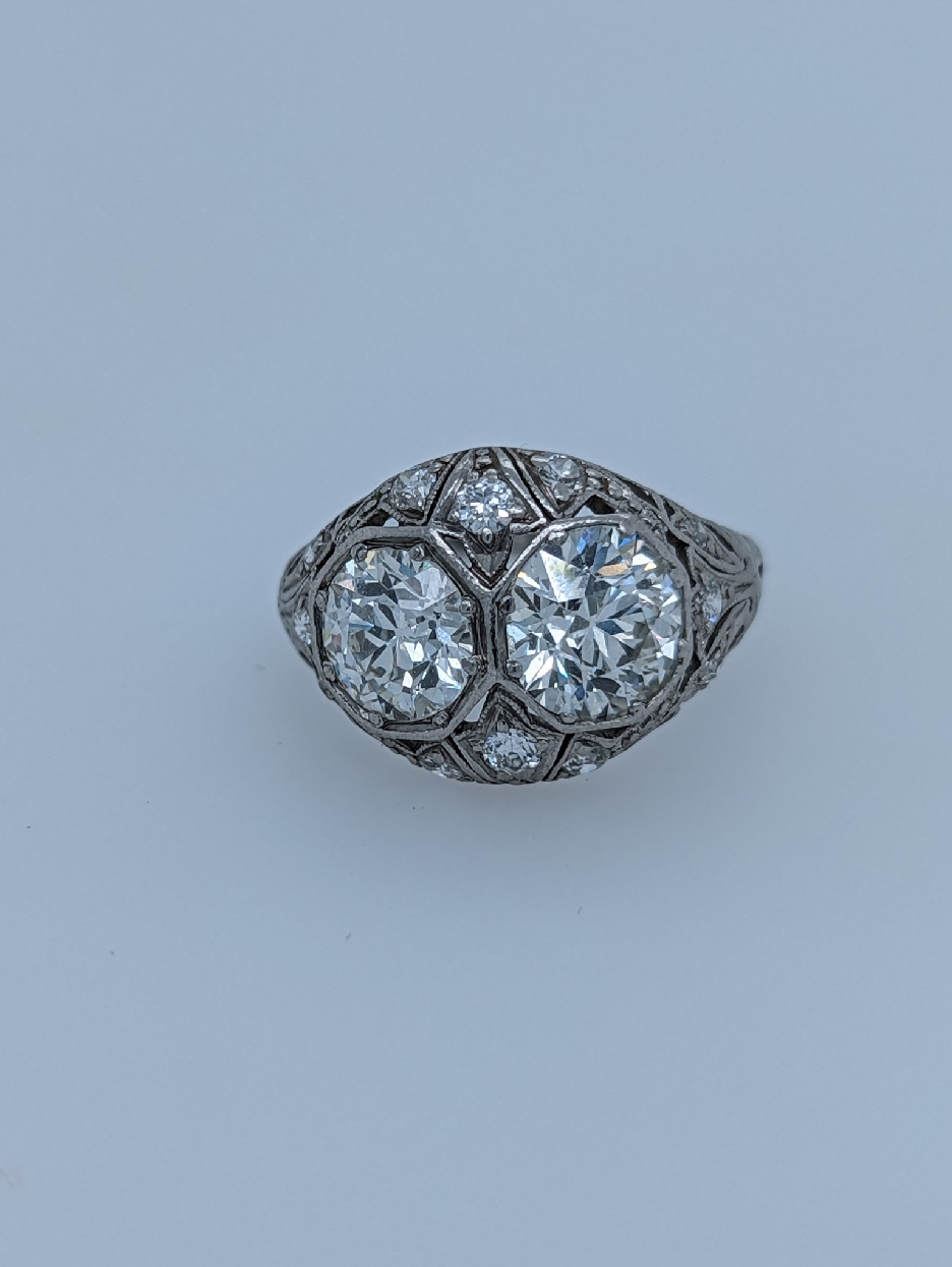 Platinum Art Deco Diamond Ring with Old European Cut Diamonds; 3.57CTTW; Size 7.5
Comes with Appraisal

One Old European Cut Center Stone Weighs 1.85CT; H-I Color; VS2 Clarity
Second Old European Cut Center Stone Weighs 1.46CT H-I Color; VS2 Clarity
Nine Full Cut Diamond Accents Weigh 0.26CTTW; I-J Color; VS2 Clarity