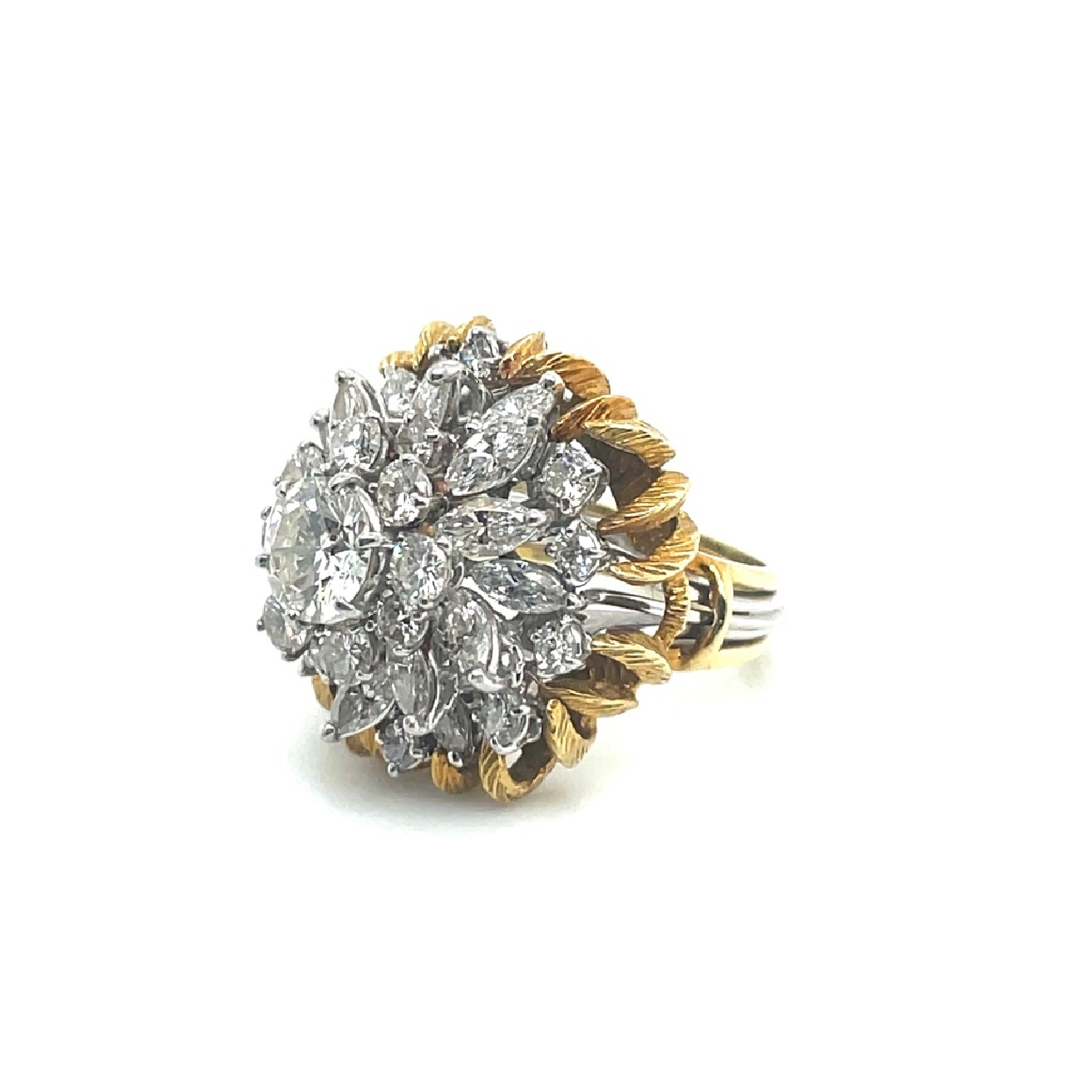 18K White Gold Diamond Cluster Ring Featuring Round and Marquise Cut Diamonds with a 18K Yellow Gold Claw Style Ring Guard. 20 RBC Diamonds 7-10 points each; 16 Marquise Diamonds 17-20 Points Each; and 1.5CT Round in Center

Size 5.5 