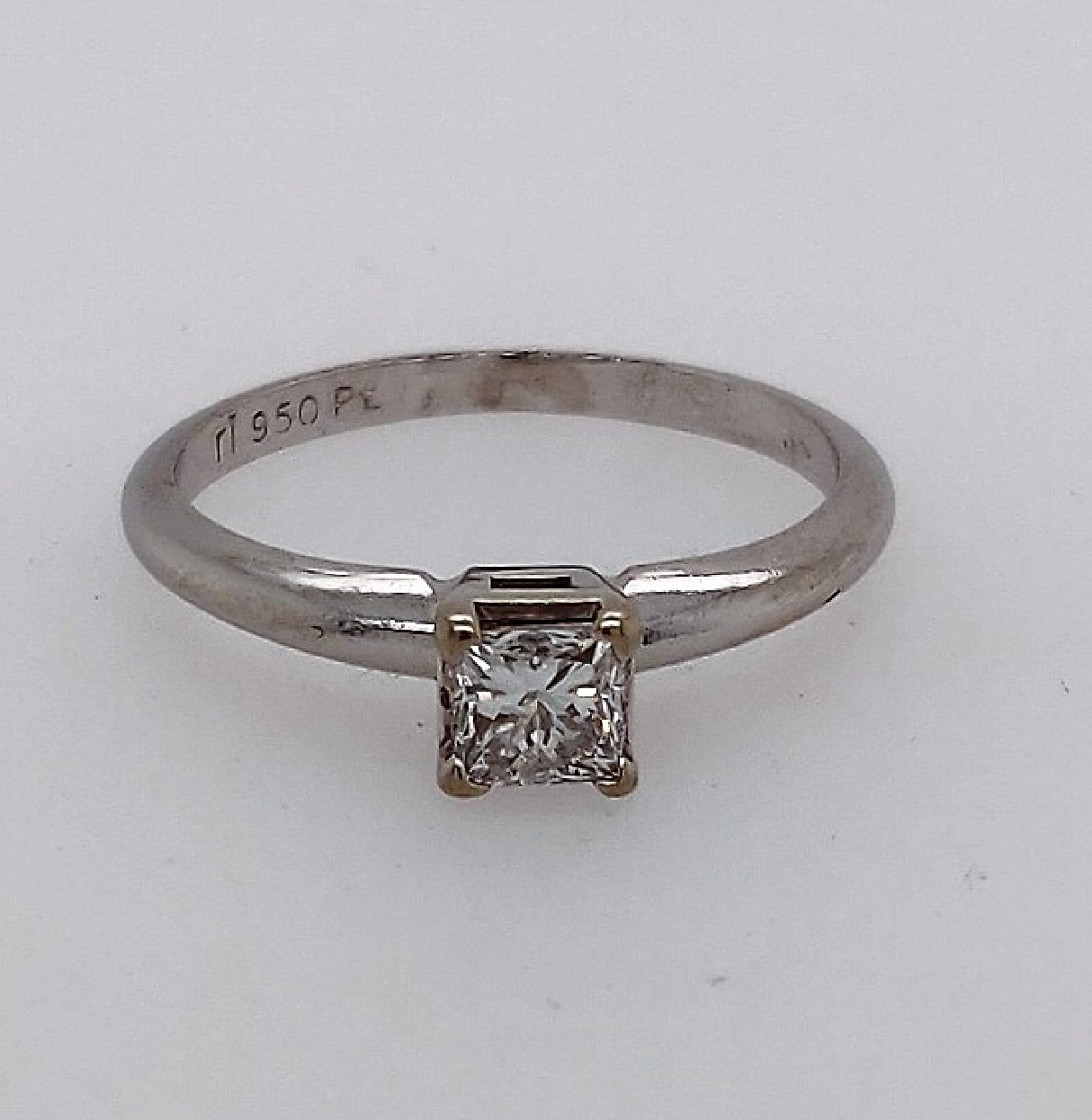 Platinum solitaire engagement ring w/ 0.45CTTW princess cut diamond. Size 6.