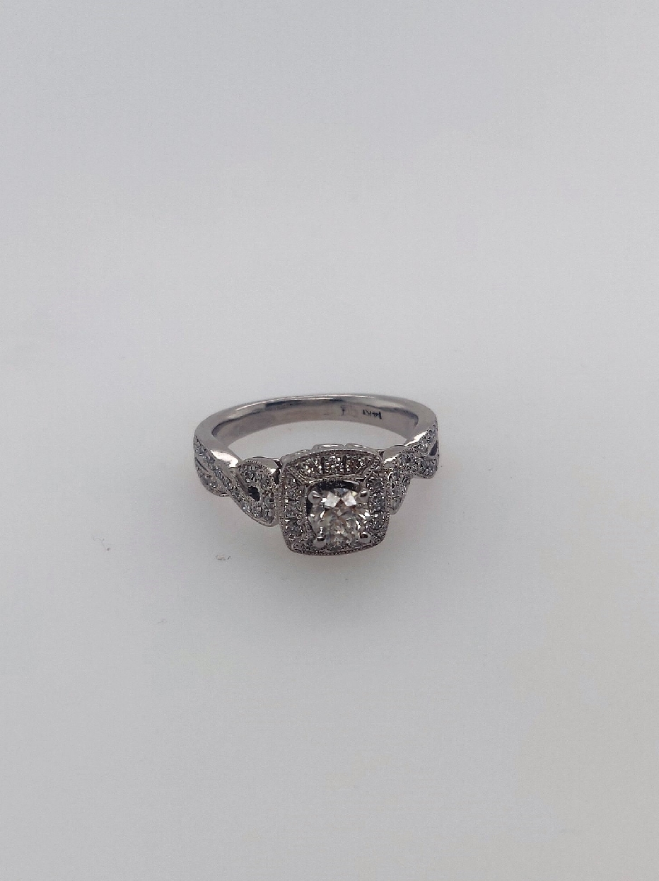 14K wg engagement ring with accents and illusion setting. Approx 0.25 CT center.