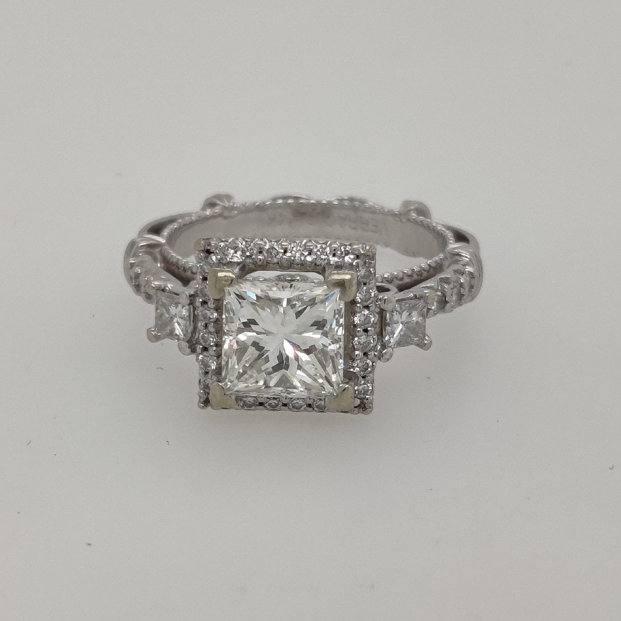 14K White Gold Verragio   Parisian   Collection Engagement Ring with 1.53 CT Princess Cut Center Stone; Size 5.25
Center Stone is J Color/SI2 Clarity
Accent Stones are approximately 0.50CTTW; G/VS2
Appraisal on File