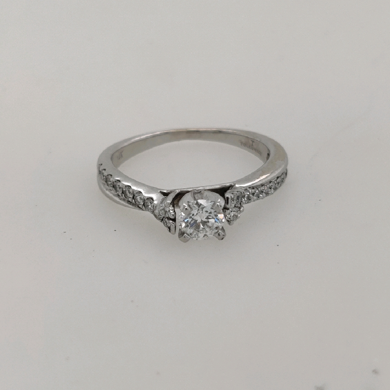 14K White Gold Engagement Ring with 0.33CT Center Stone with Diamonds on the Shank; Size 5.75

Center Stone is F Color; SI1 Clarity