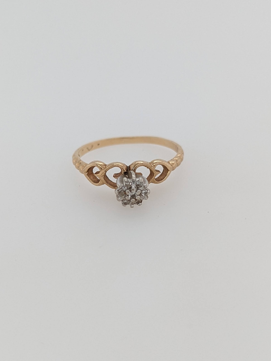10K Yellow Gold Diamond Cluster Engagement Style Ring with Heart Accent on the Shank; Size 7.5