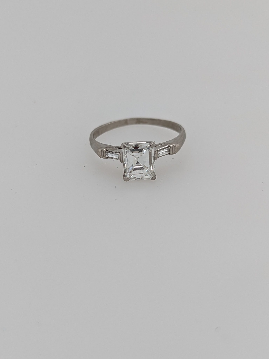 Platinum Art Deco Engagement Ring with Rare Period Cut Emerald Cut Diamond with Baguettes; Size 7.25

Center Stone is 1.30 CT; G Color; VS1 Clarity
Baguettes weigh 0.10CTTW; F-G Color/VS Clarity

Appraisal on File