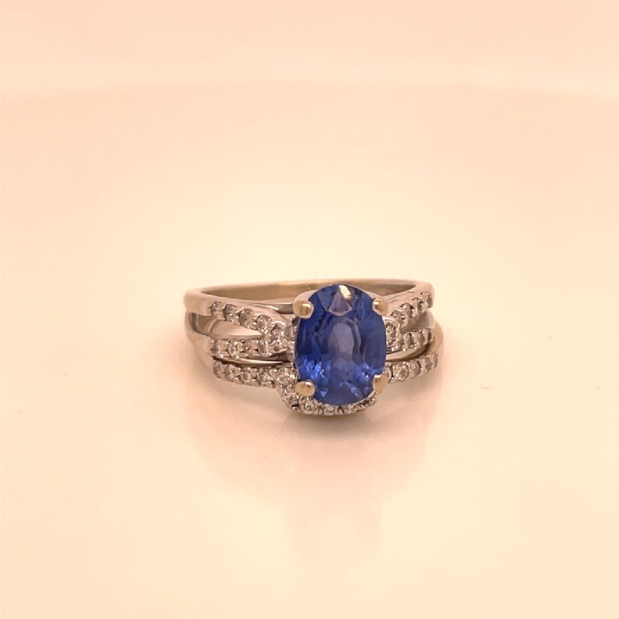 18K White Gold Sapphire and Diamond Engagement Ring with Matching 18K White Gold Diamond Band

Size 5