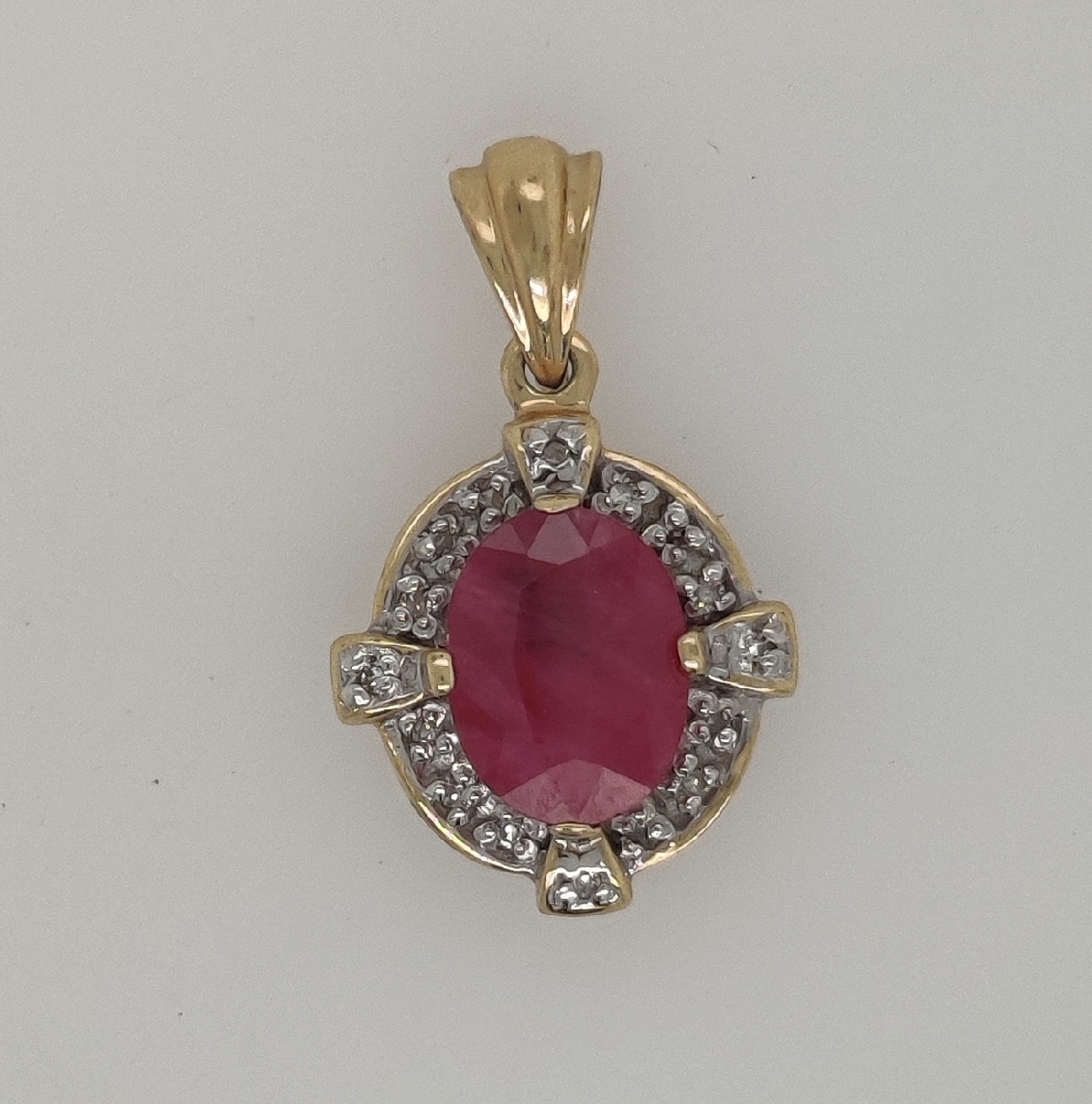 14K Yellow Gold Oval Shaped Ruby Pendant with Diamond Accents