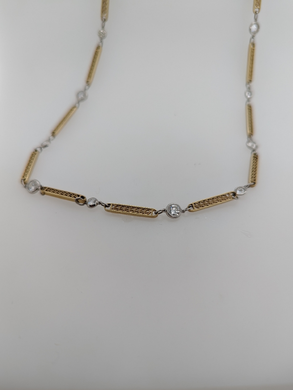16 inch 14K Yellow Gold and Platinum Bezel Set Diamond Station Necklace 
3.15ctw VS1-VS2/G-H 
Comes with Apprasial 