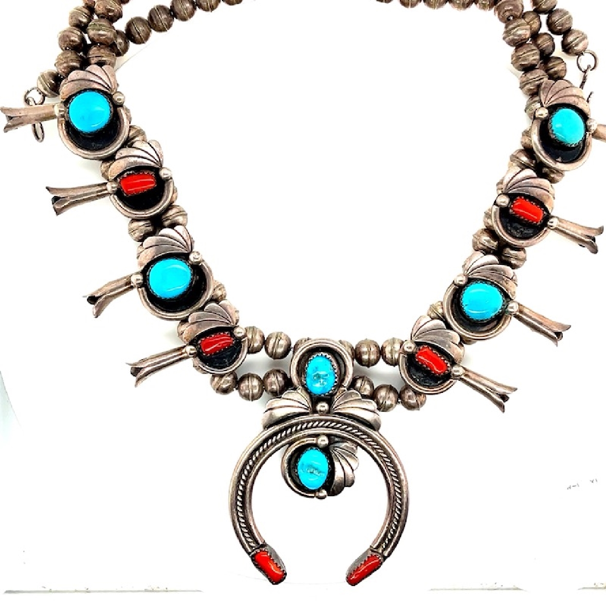 Sqashblossom Necklace In Sterling Silver with Turquoise and Coral

24 Inches
