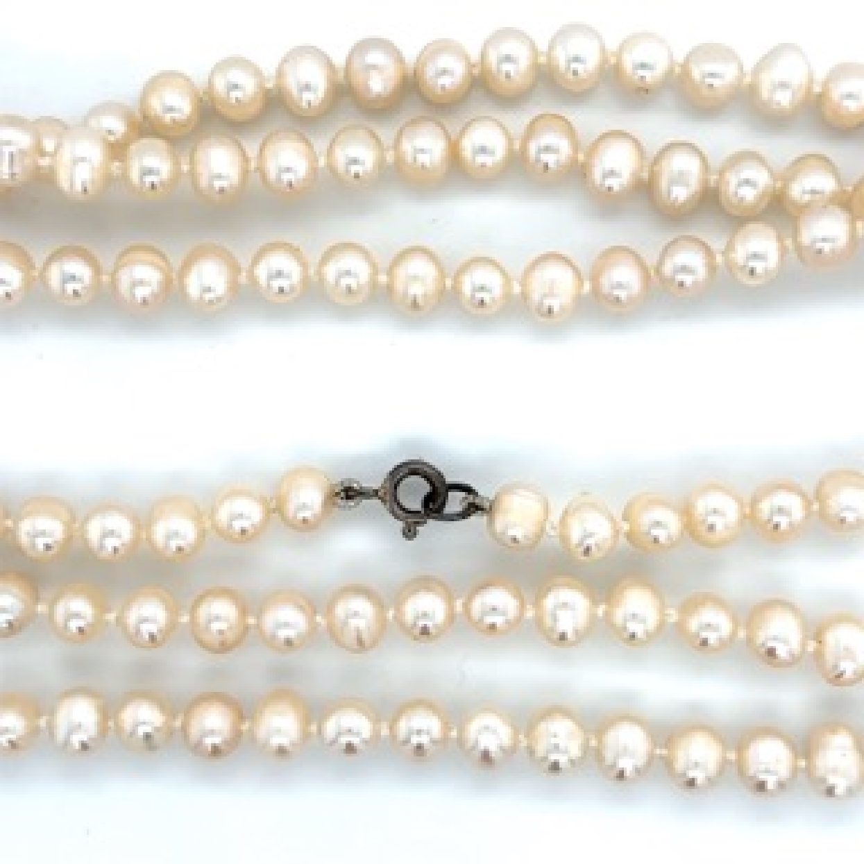Single Strand of Fresh Water Pearls with a Sterling Silver Clasp

5 mm 
36 Inches 