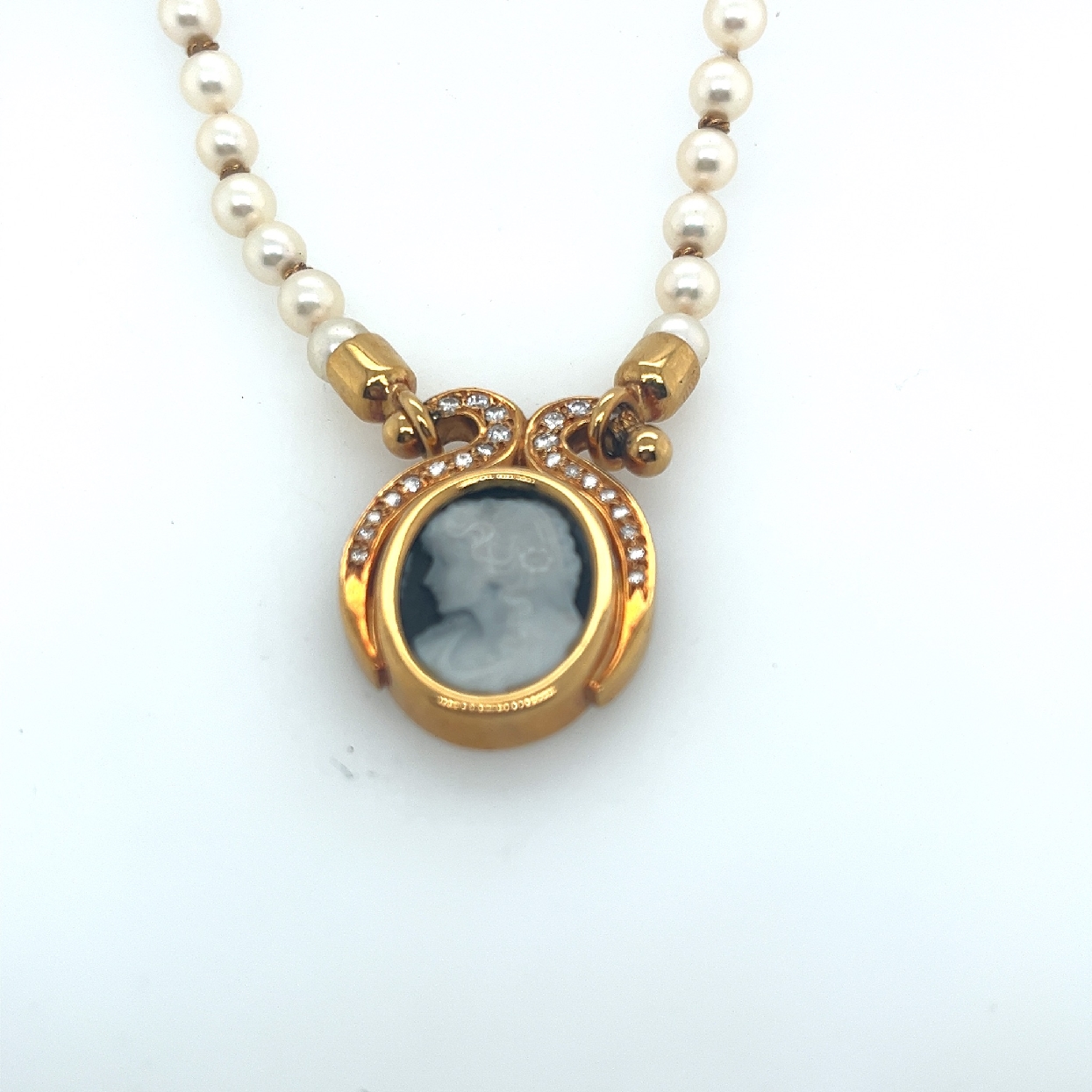 18K Yellow Gold Stationary Sardonyx Cameo Pendant on Hand Knotted White Pearl Strand

16 Inches in Total Length