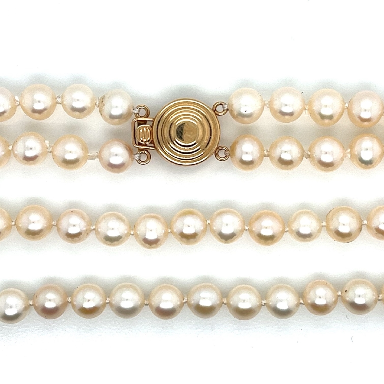 Double Strand of 5.5-6mm Akoya Pearls with 14K Yellow Gold Clasp 

Short Strand is 17 Inches 
Longer Strand is 18 Inches