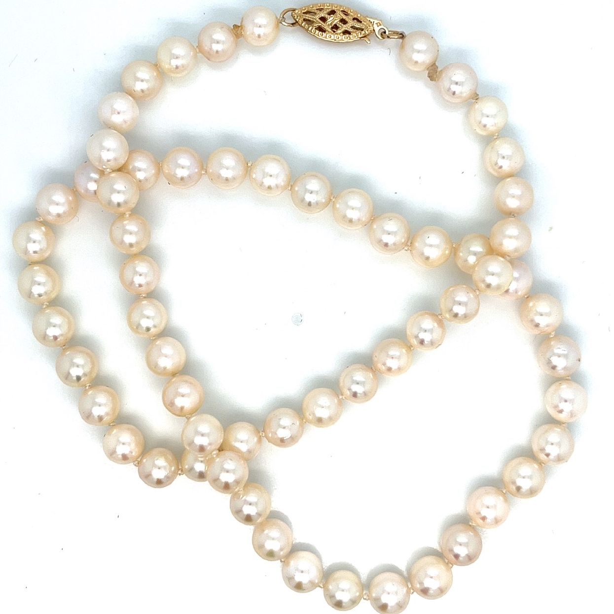 6-6.5mm Round White Pearls with Slight Pink Luster and 14K Yellow Gold Clasp 
16 Inch Necklace