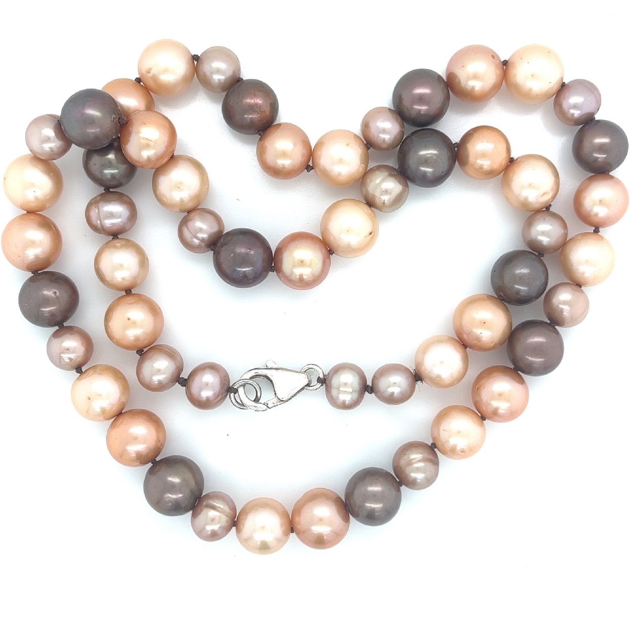 Variegated Brown/Taupe Pearl Strand with Sterling Silver Clasp

6-9mm Pearls Varying Size and Shape
19.5 Inches