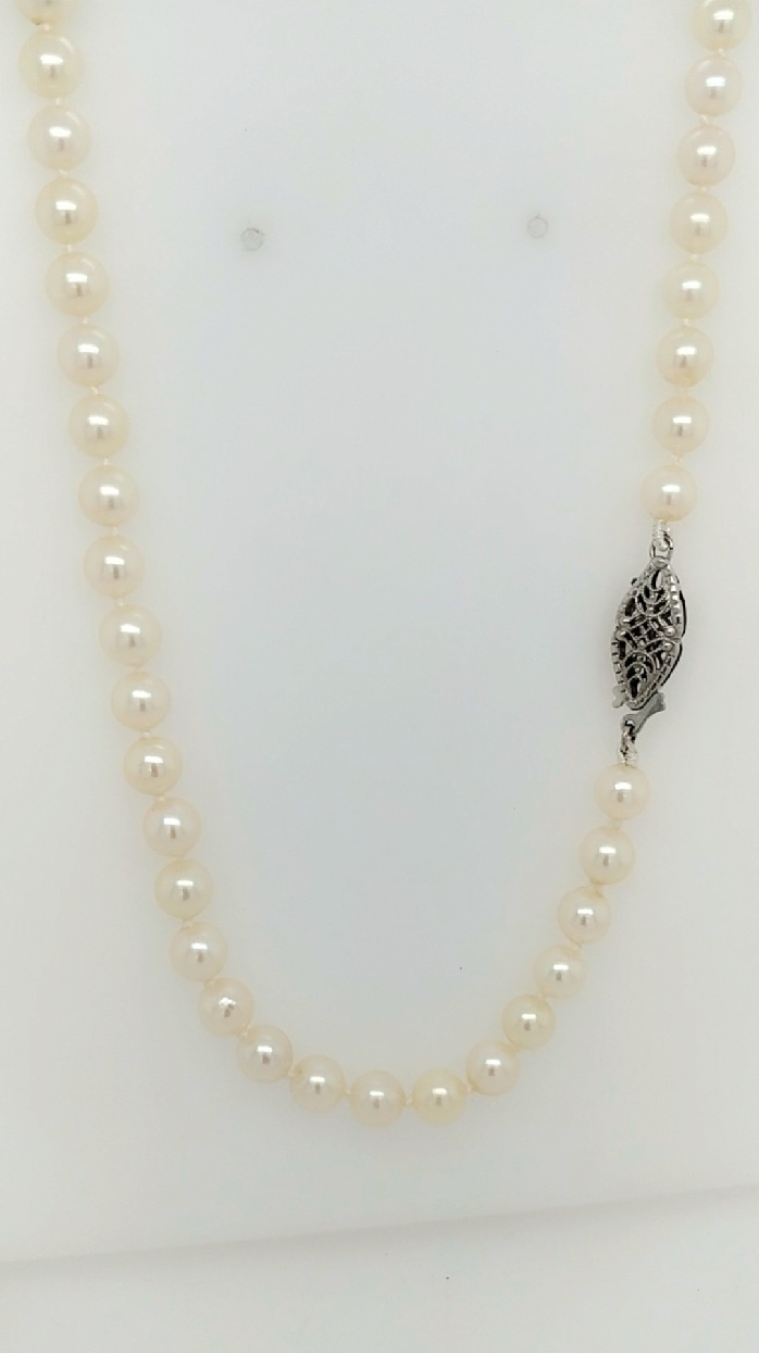 32   strand of Akoya 5-5.5mm pearls with 14kt gold clasp.