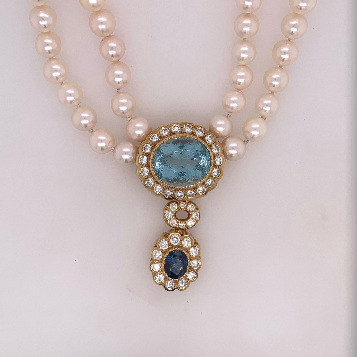 18k Yellow Gold Natural Oval Aquamarine and Natural Oval Sapphire Fixed Pendant with Diamond Halos on a Double Strand Salt Water Pearl Necklace 18  