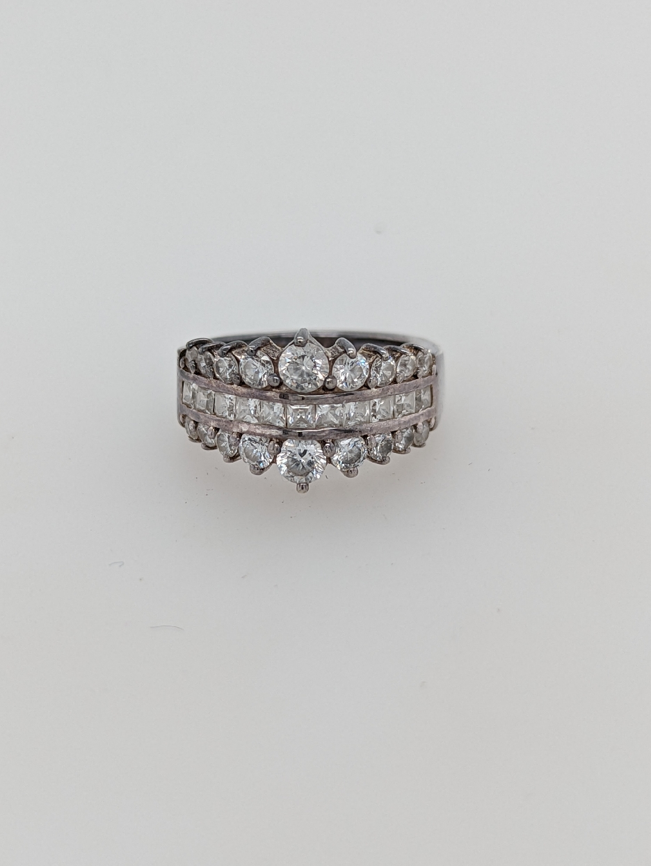 Sterling Silver Ring with Triple Row of Prong and Channel Set CZ s
Size 5 