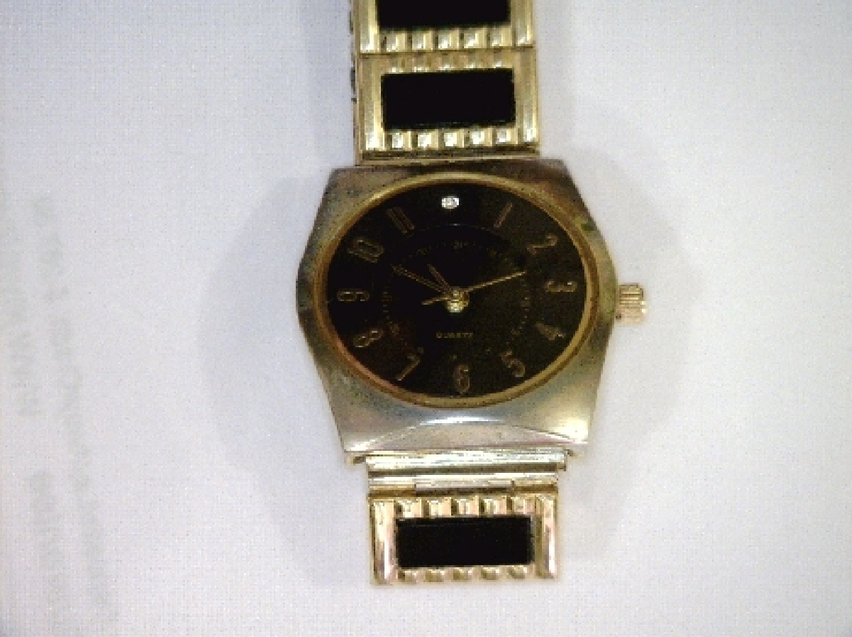 Black and gold Art Deco styled Quartz stretchy band wristwatch.