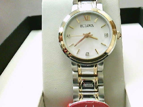 109: Ladies bulova Mother of Pearl dial with diamonds Two tone buckle watch strap