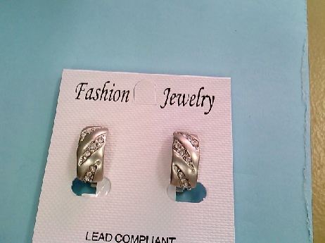 1210: One pair of silver tone half hoop clip earrings with 3 rows of white crystals