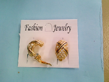 1222: One pair of gold tone costume clip earrings with white crysatals and a Black enameled X 