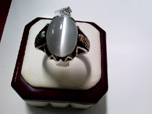 1723: One sterling silver 925 gents oval synthetic Grey Katsite stone ring with a Dragon motif shoulder