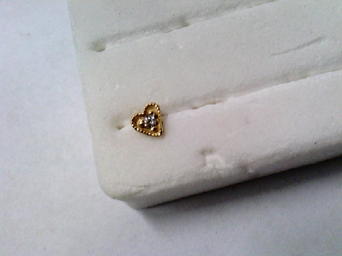 1724: 14k yellow heart shaped nose stud set with white Cubic Zirconia