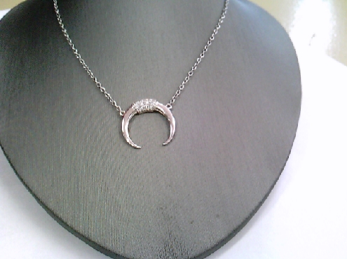 1917: One sterling silver necklace of a crescent moon set with white cz s