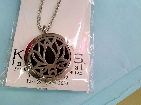 2268: One stainless steel Aroma Therapy gage with 5 felt pads assorted colors with a Lotus flower or Tree of Life motif 