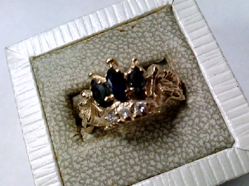 2452: One custom made 10k yellow gold Crown motif ladies ring set with three marqis shaped Genuine Sapphire and thee round brilliant cut diamonds 