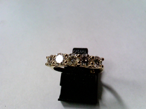 2594: One ladies 14k yellow gold 5 round brilliant cut diamond Lucina style band.
3.8/3.9 to 4.10mm  approx. 1.00crtw
SI1 HIJ 