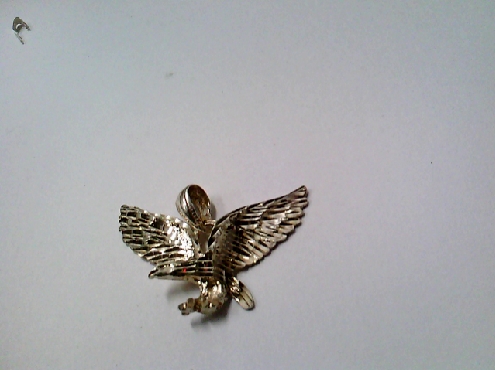 2597: One sterling silver spread winged landing Eagle charm