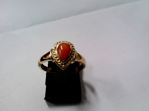 2613: One ladies 10k yellow gold Genuine pear shaped Red Coral ring