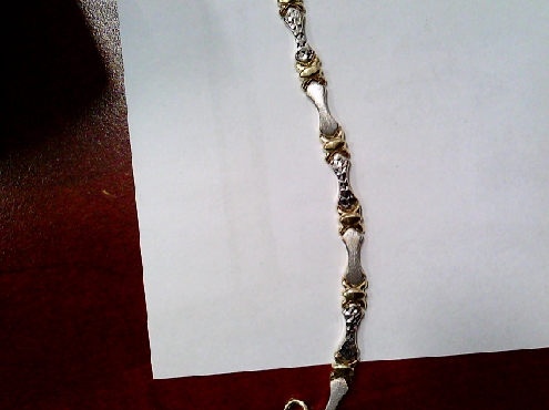 2674: 10k two tone diamond cut hugs and kisses bracelet7.5 inches 4.75mm